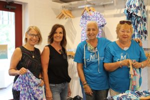 Local business buys 800 pieces of clothing for charity organization Local business buys 800 pieces of clothing for charity organization